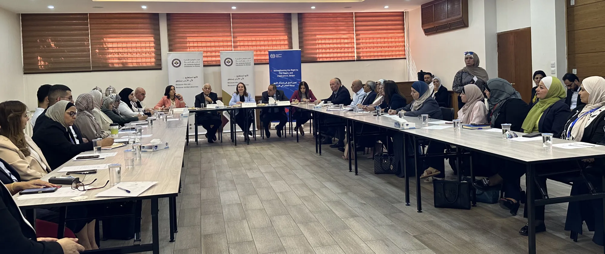 a group of people meeting During the 19th meeting of the National Committee for Pay Equity at the Jordanian National Commission for Women.