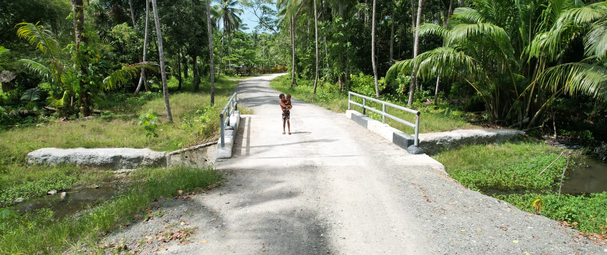 Children walking on a newly rehabilitated road