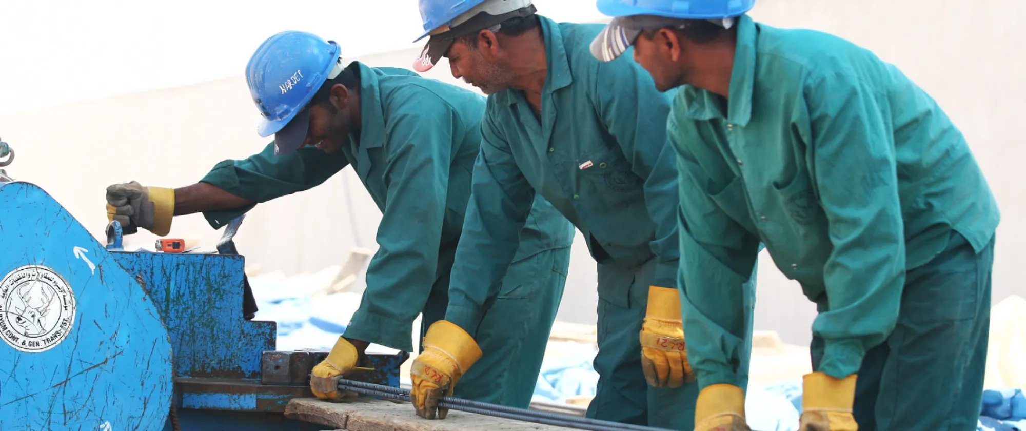 3 men working on a construction site 