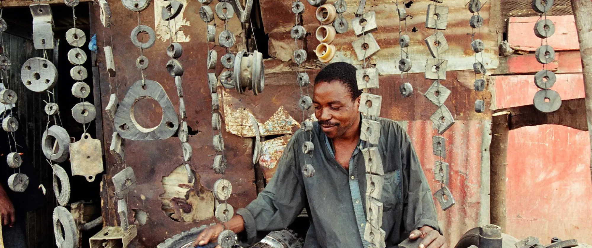 Small workshop recycling sealing rubber for cars from old tyres. Mandera Road, Dar Es Salaam.