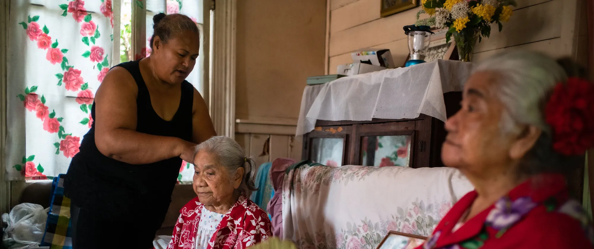 Siutiti, caregiver, brushing the hair of the elderly, Tonga