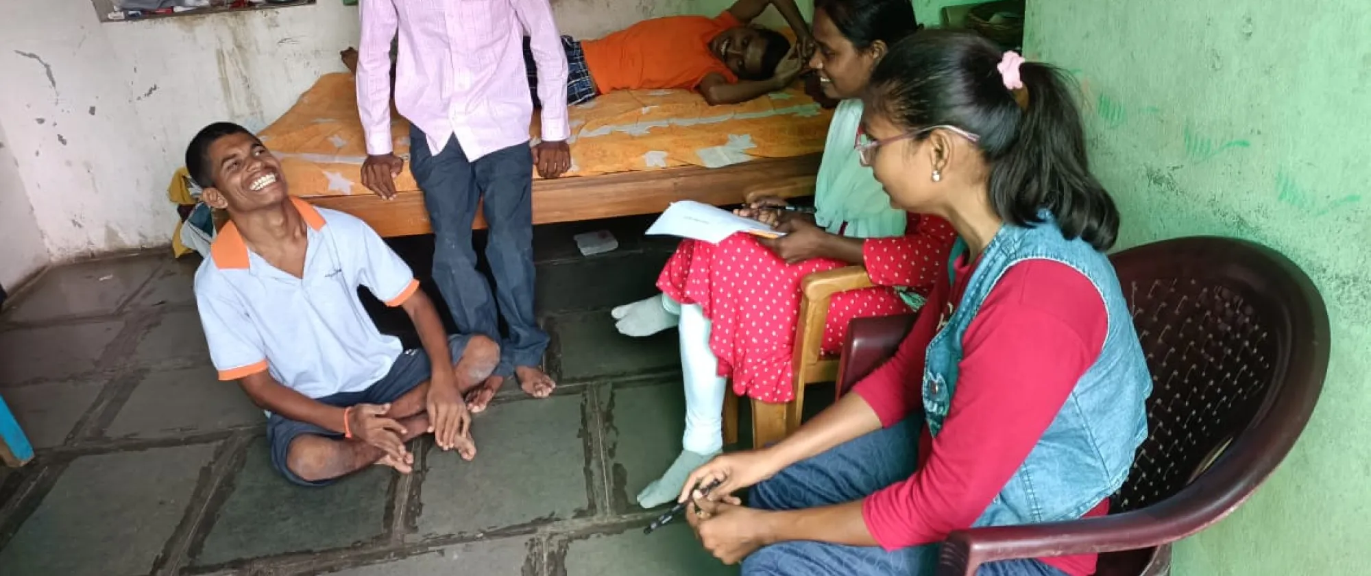 People sitting on the floor and chairs