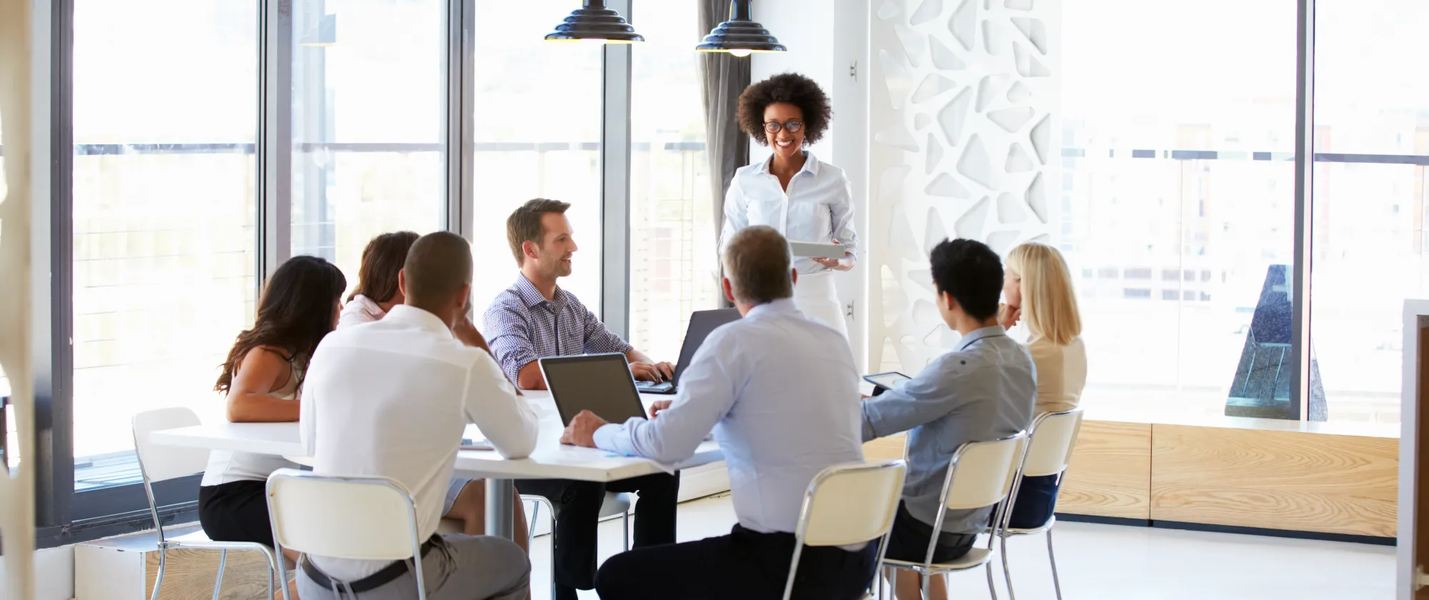 Group of people in a training around the table