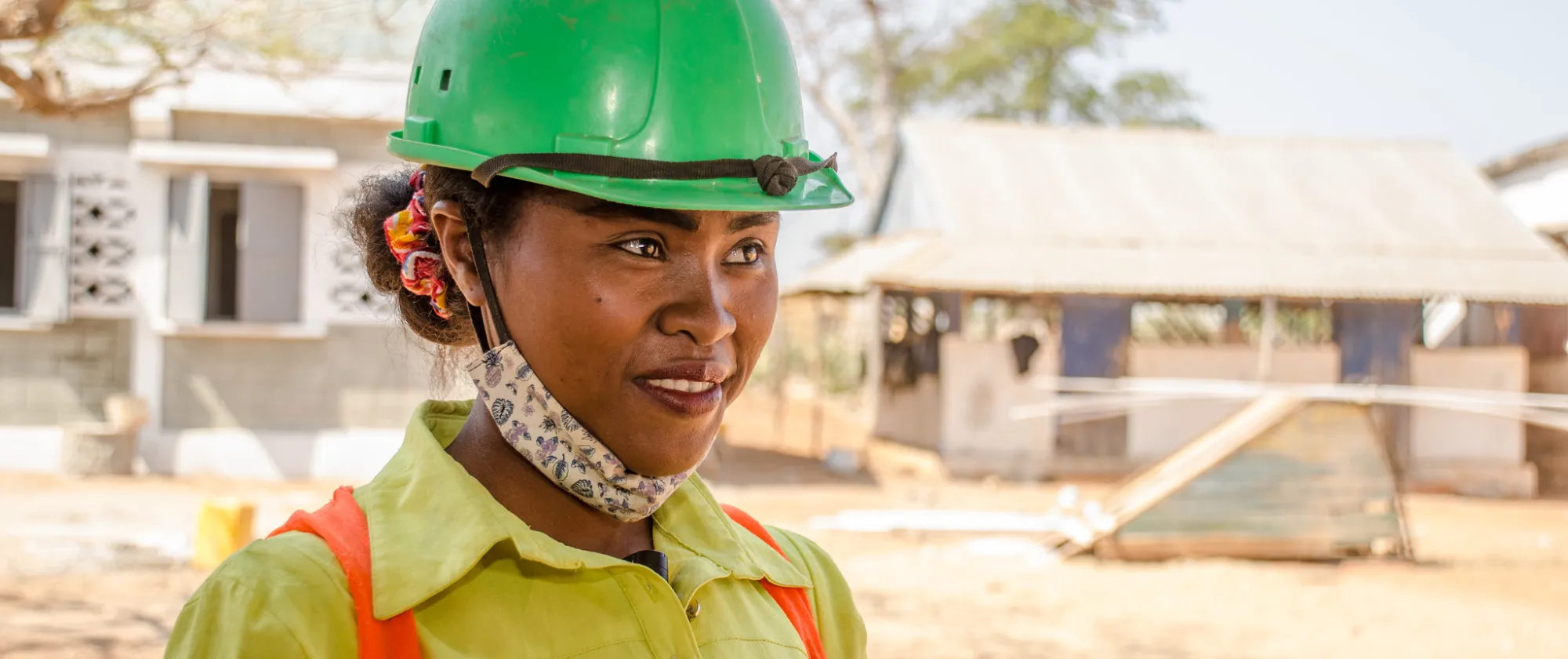 Woman wearing a green construction hat