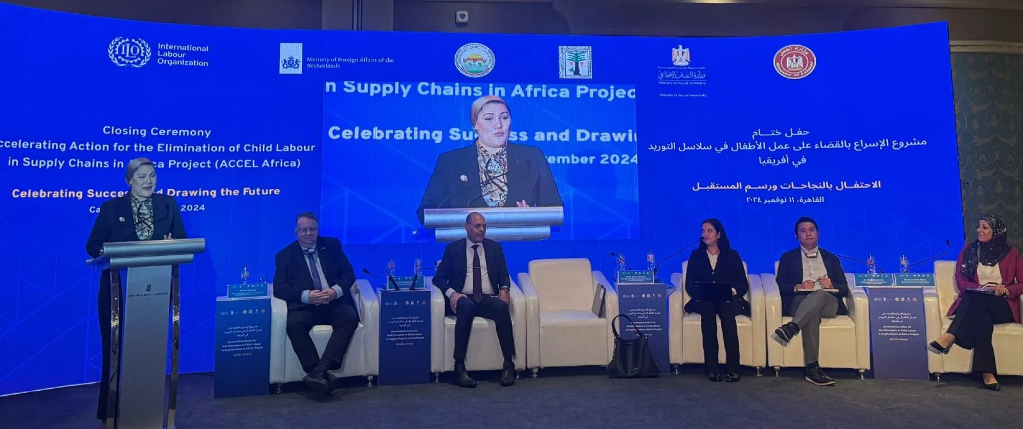 A panel discussion with a blue colour background