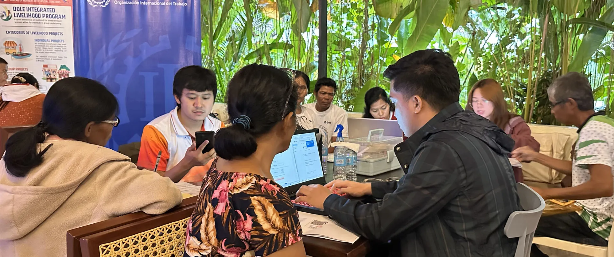 workers at a social protection online and one-stop registration