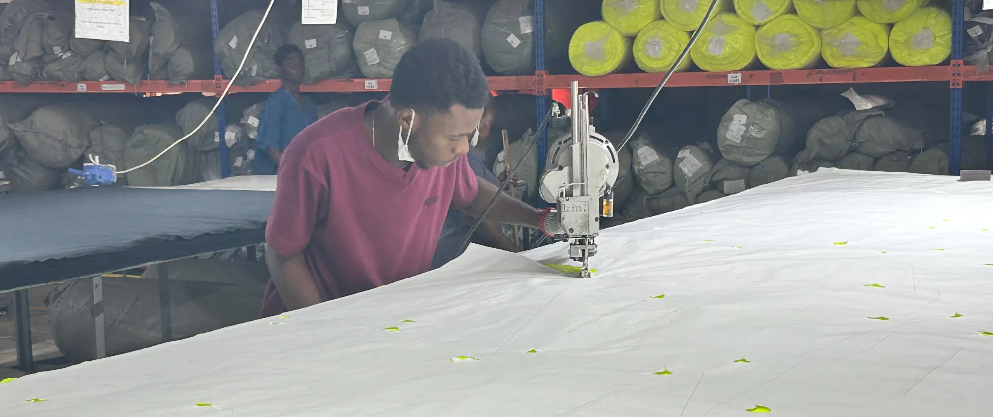 Worker at Textile Factory working with a machine