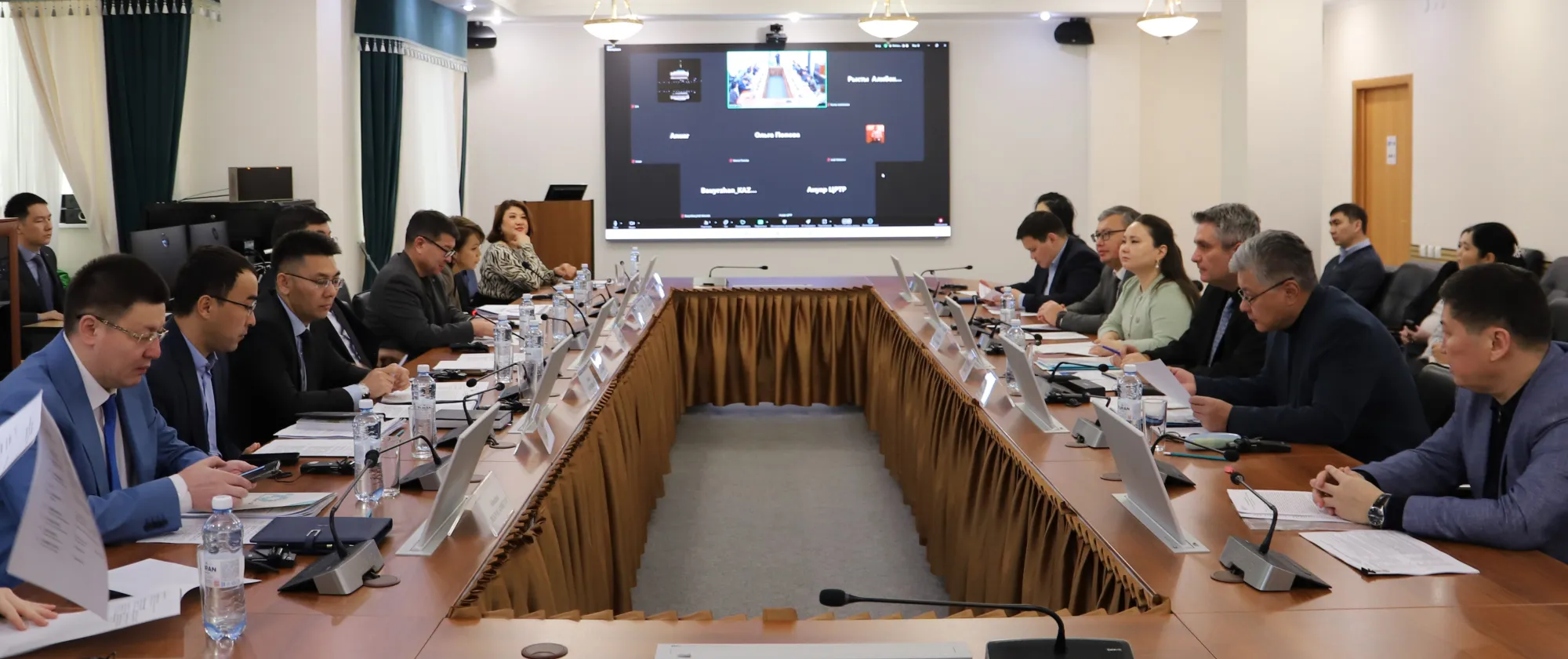 Group of people sitting around the 0-shaped table for the official launch roundtable for the RBSA project in Kazakhstan on 3 December 2024