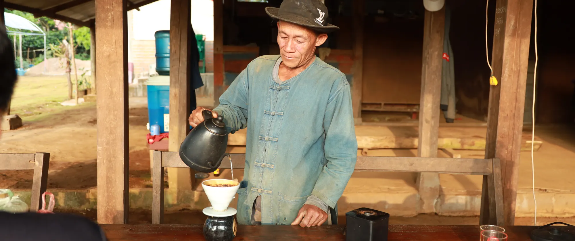 A man is making coffee.