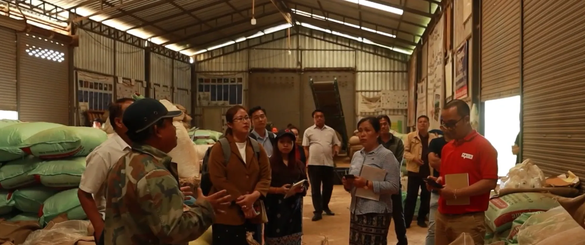 People standing in a coffee beans storage. 