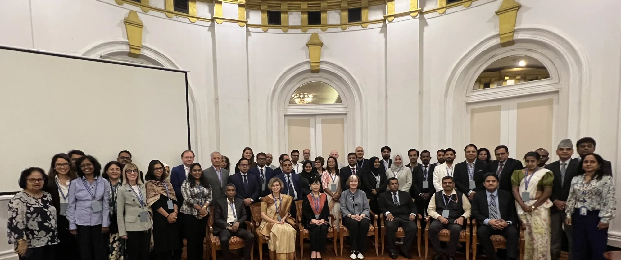 Men and women in a conference hall