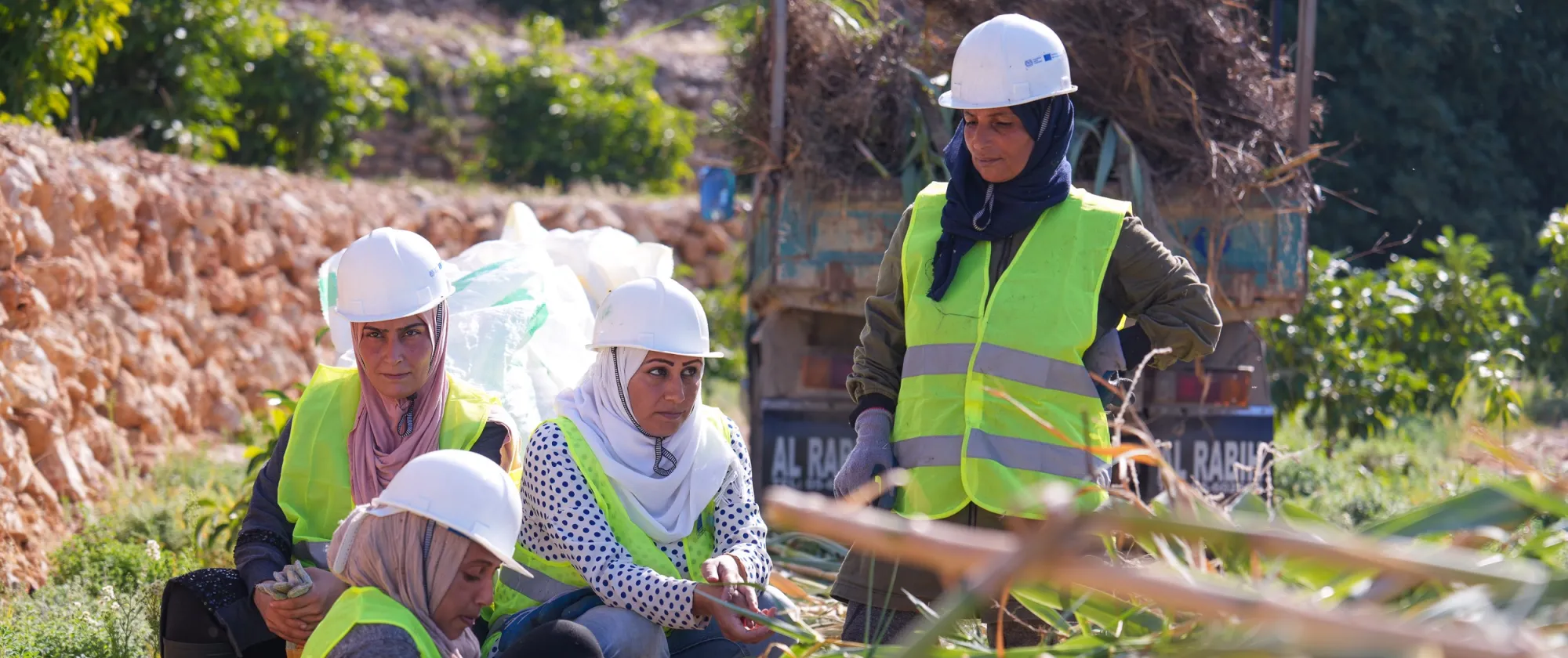 Women beneficiaries working in cleaning and rehabilitation of Damour Canal as part of the ILO ENABLE project in Damour, Lebanon. November 2023.