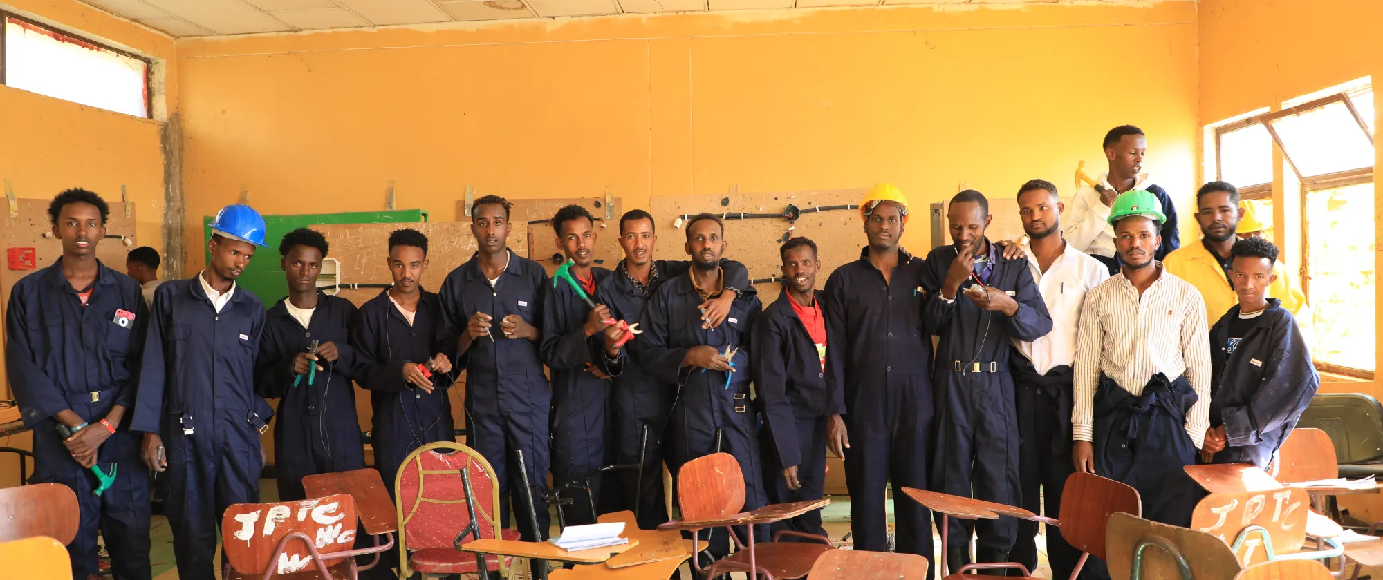 men at vocational training center wearing uniform