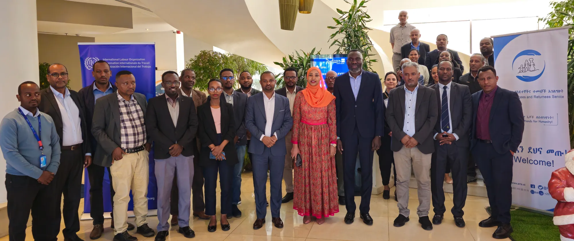 A group picture of participants of high-level dialogue focused on improving and strengthening the extension of social health protection to forcibly displaced persons in Ethiopia. 