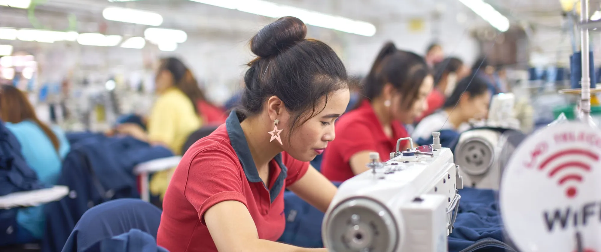 Workers sewing.