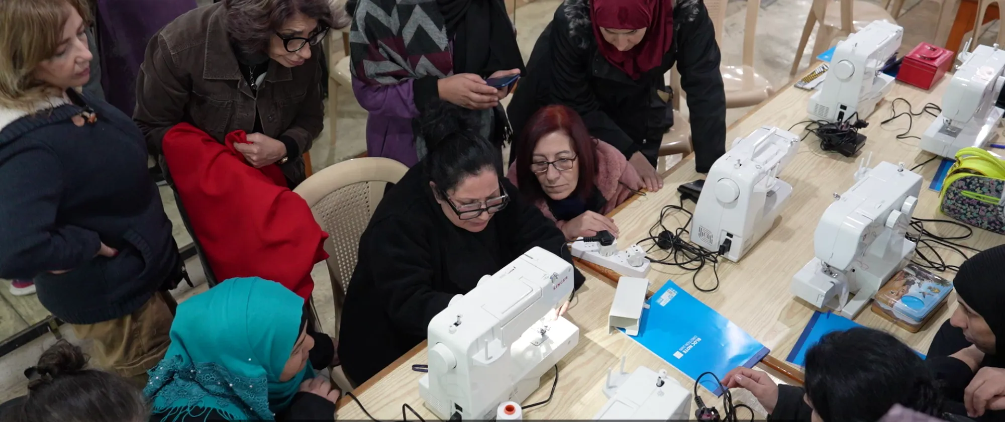 women learning tailoring