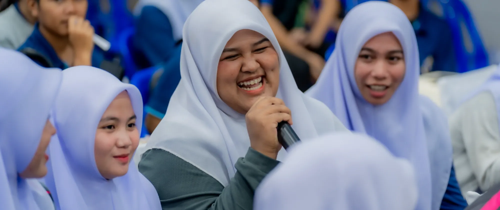 A woman speaks while other listening.