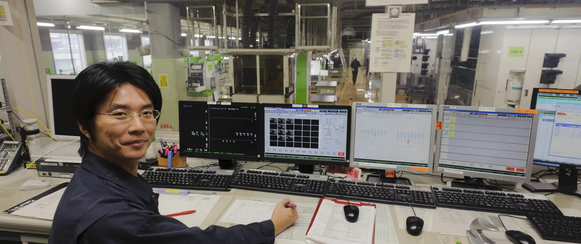 Technician in the computers room. Printing the Asahi Shimbun Newspaper evening edition. Kyoto Printing Factory. Kyoto, Japan.