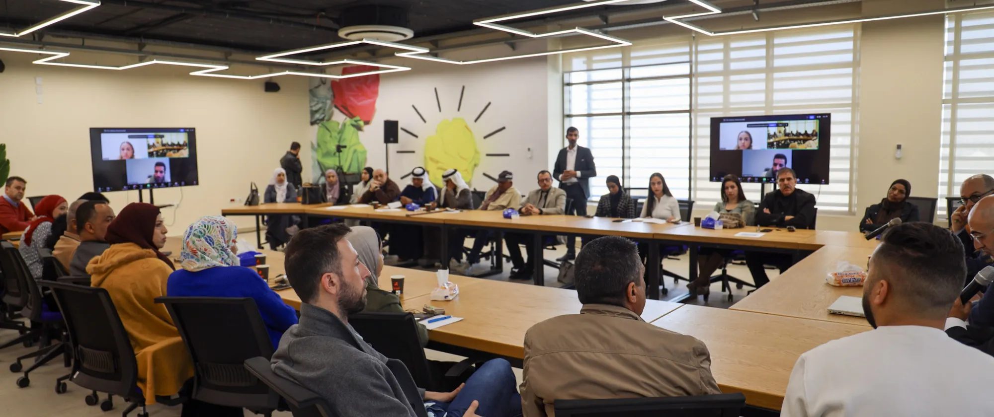 a group of people in a meeting