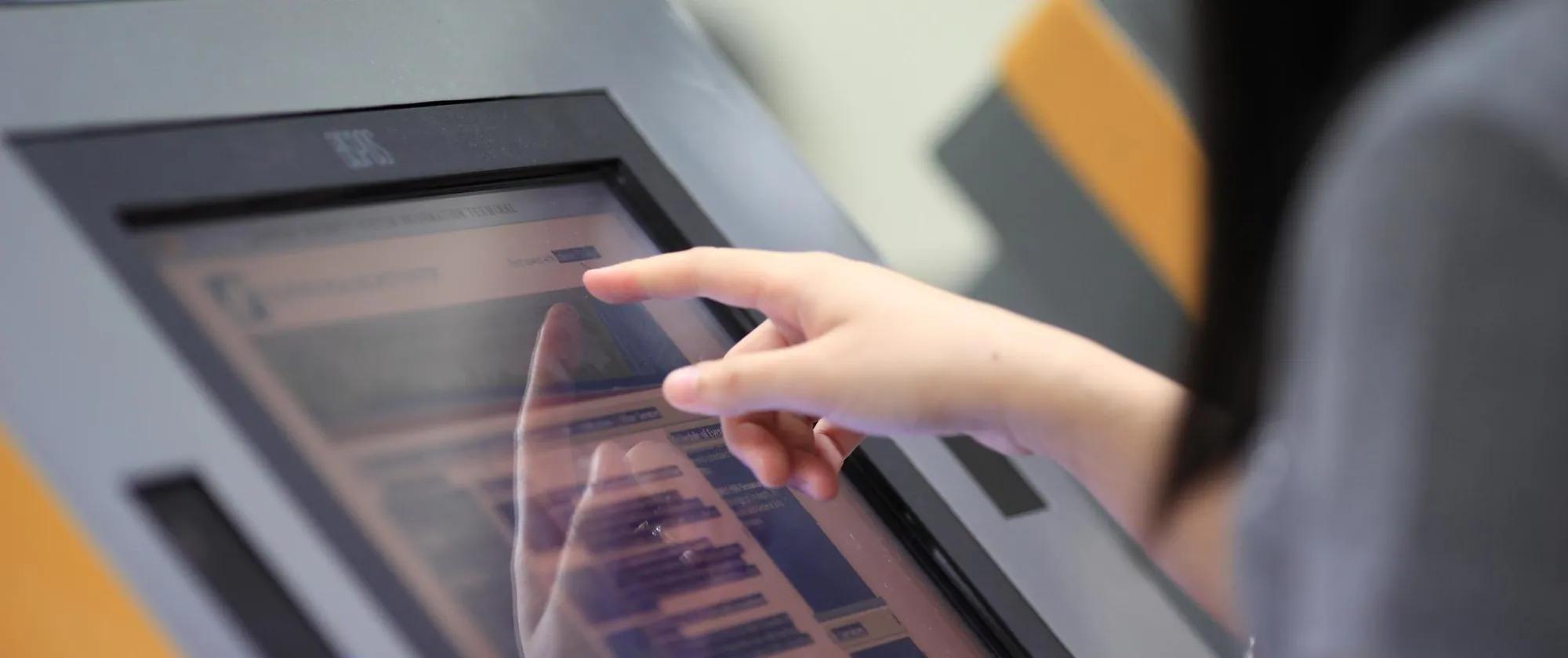 use of touch-screen computer to register and access information