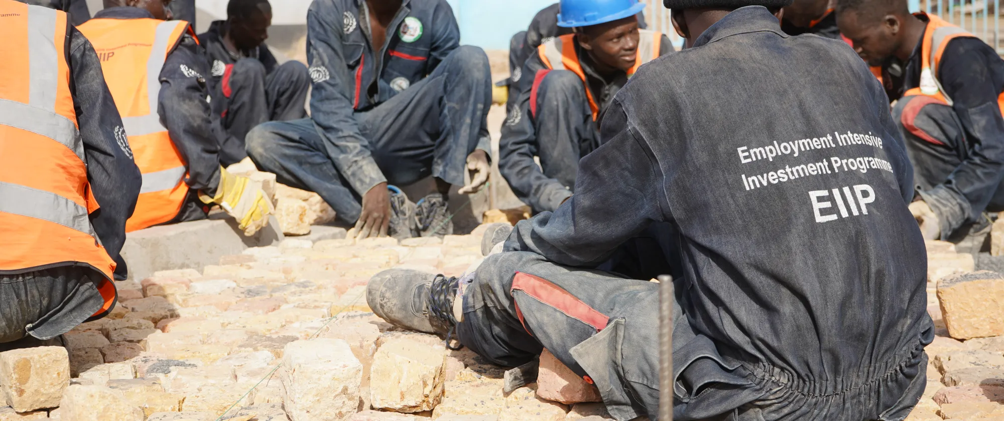 Students paving the fresh produce market with cobblestone in Turkana