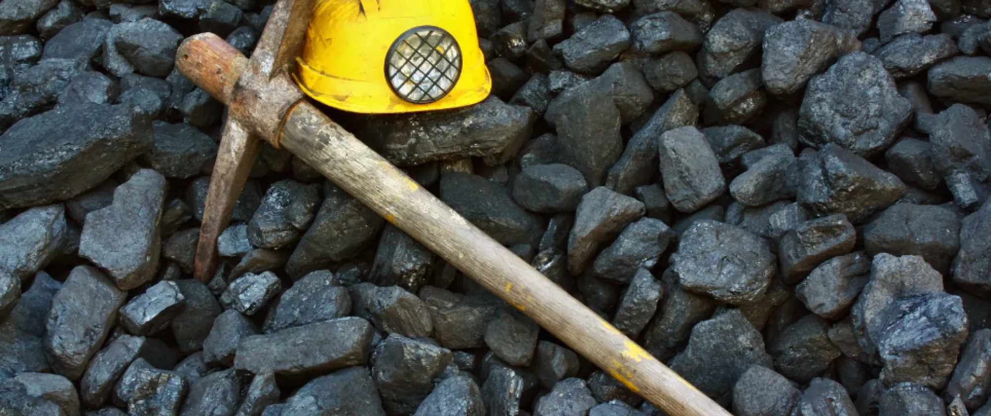A pick and a helmet in a mine