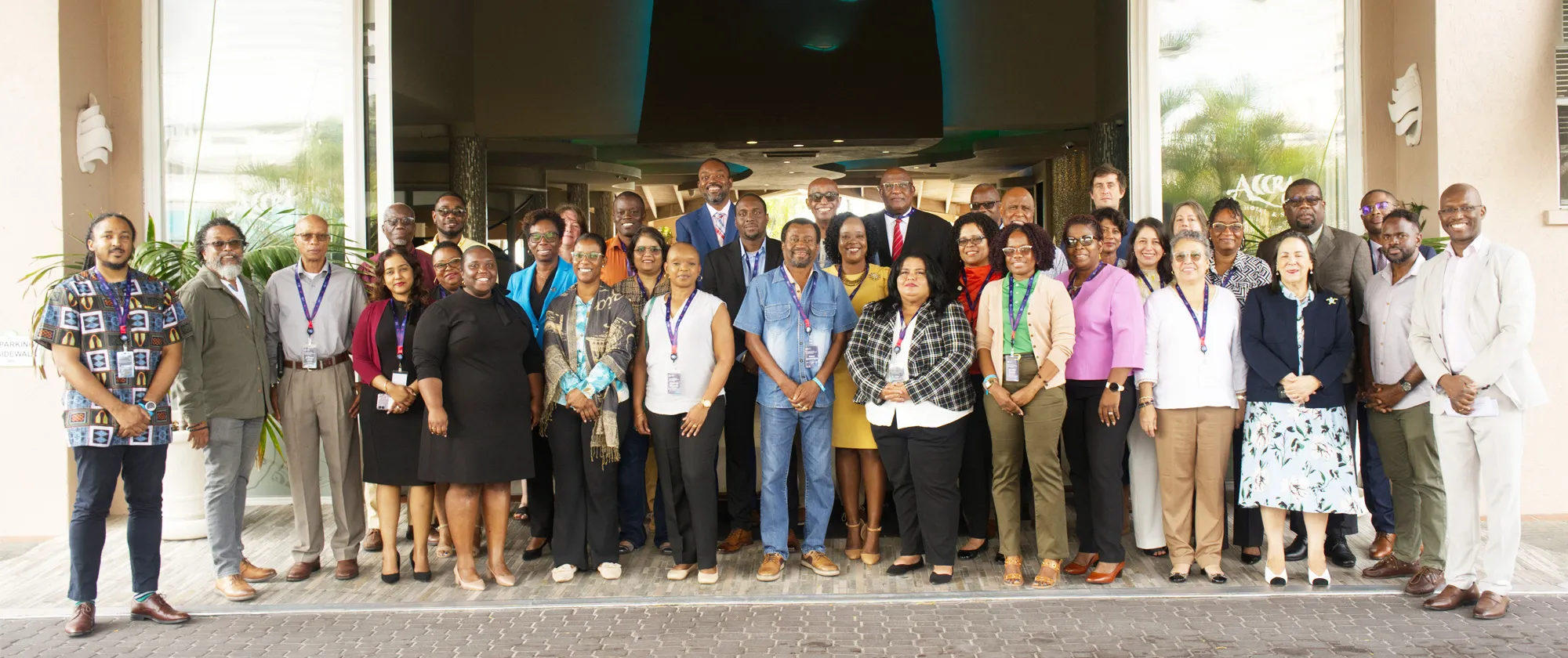 A group photo taken at the conference titled New Social Contract - A Trade Union Perspective for the Caribbean, held in Barbados on February 25-26, 2025. Approximately 30 people are standing together in three rows