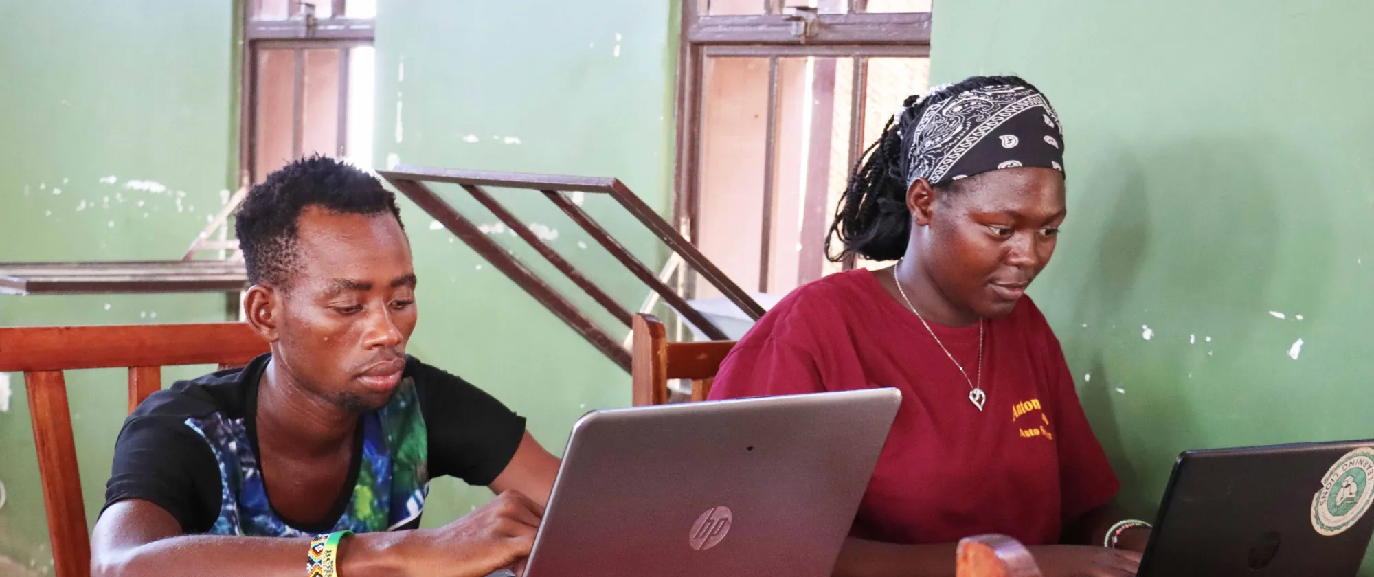Two students on laptops 