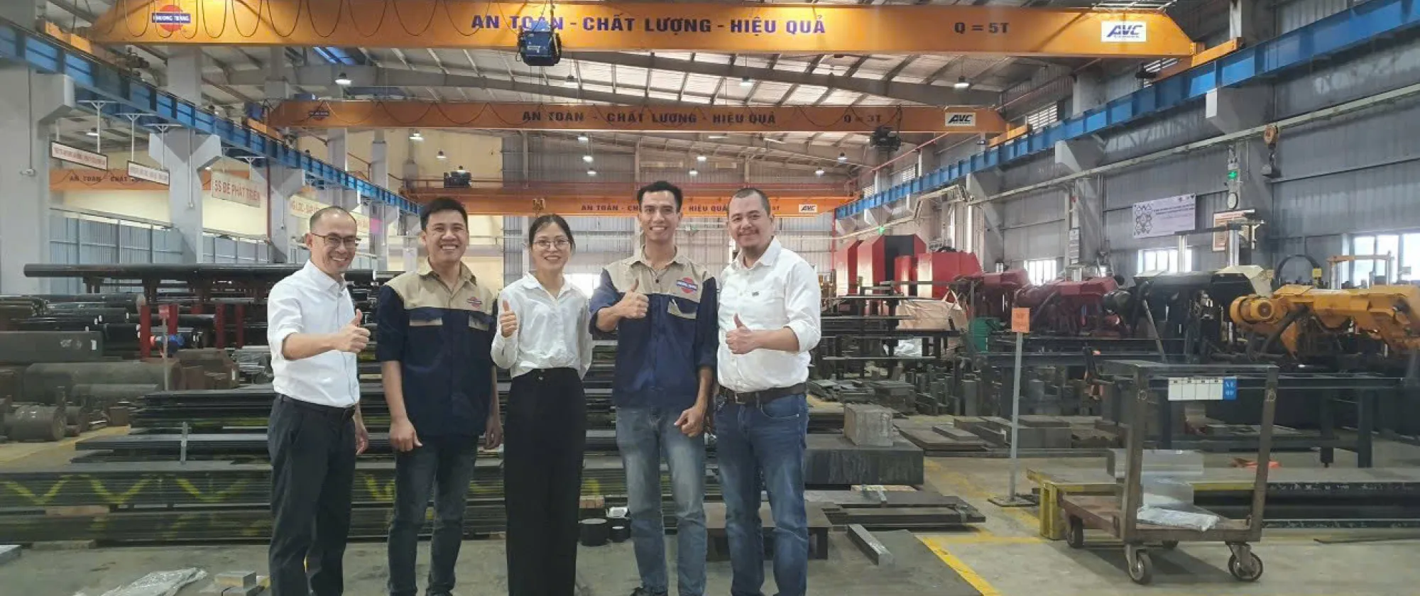Nhung, a female consultant is giving a thumbs up with staff from ILO Productivity Ecosystems from Decent Work.