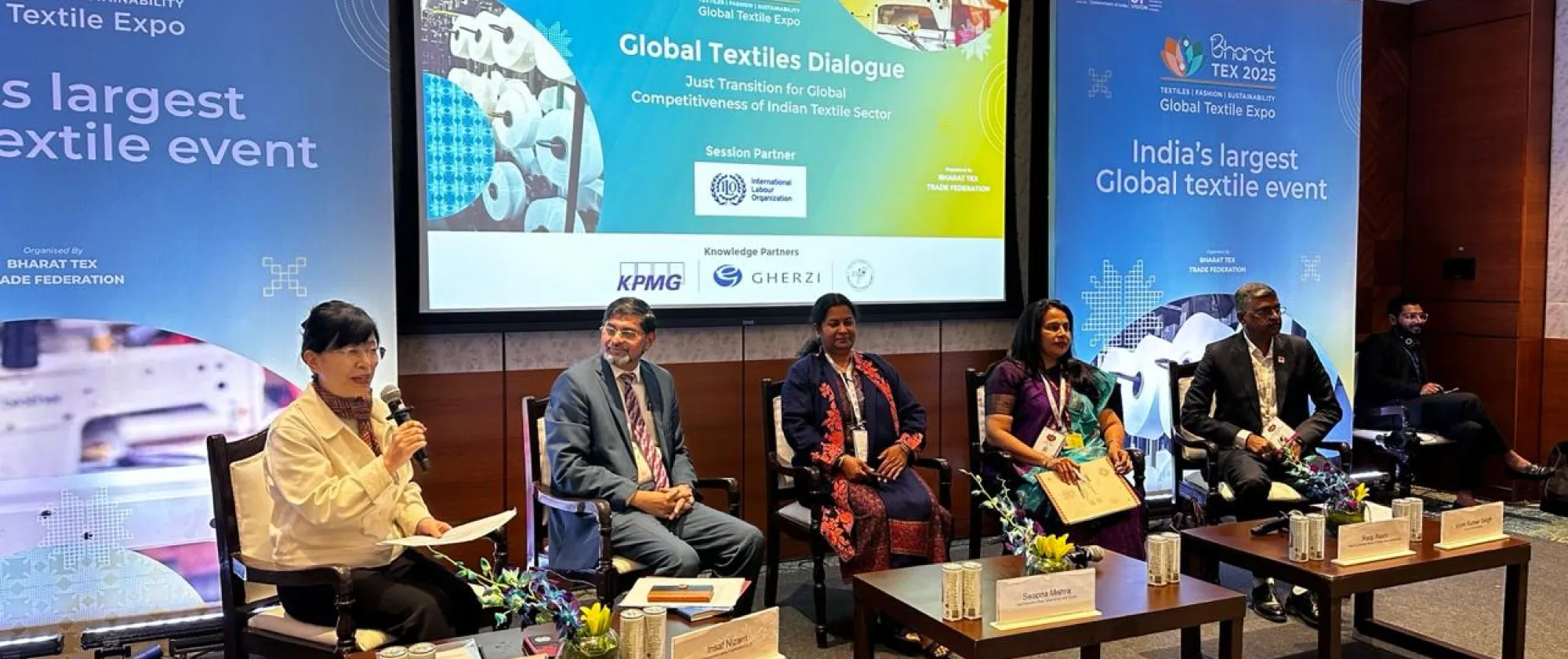 Panel of women and men at the dais