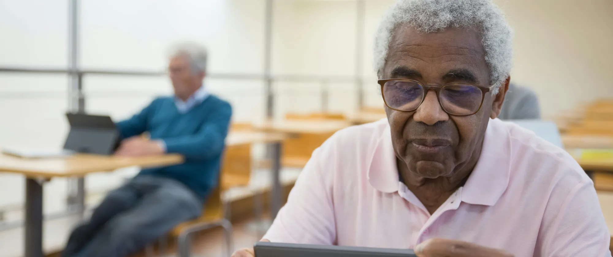 Older man using a table