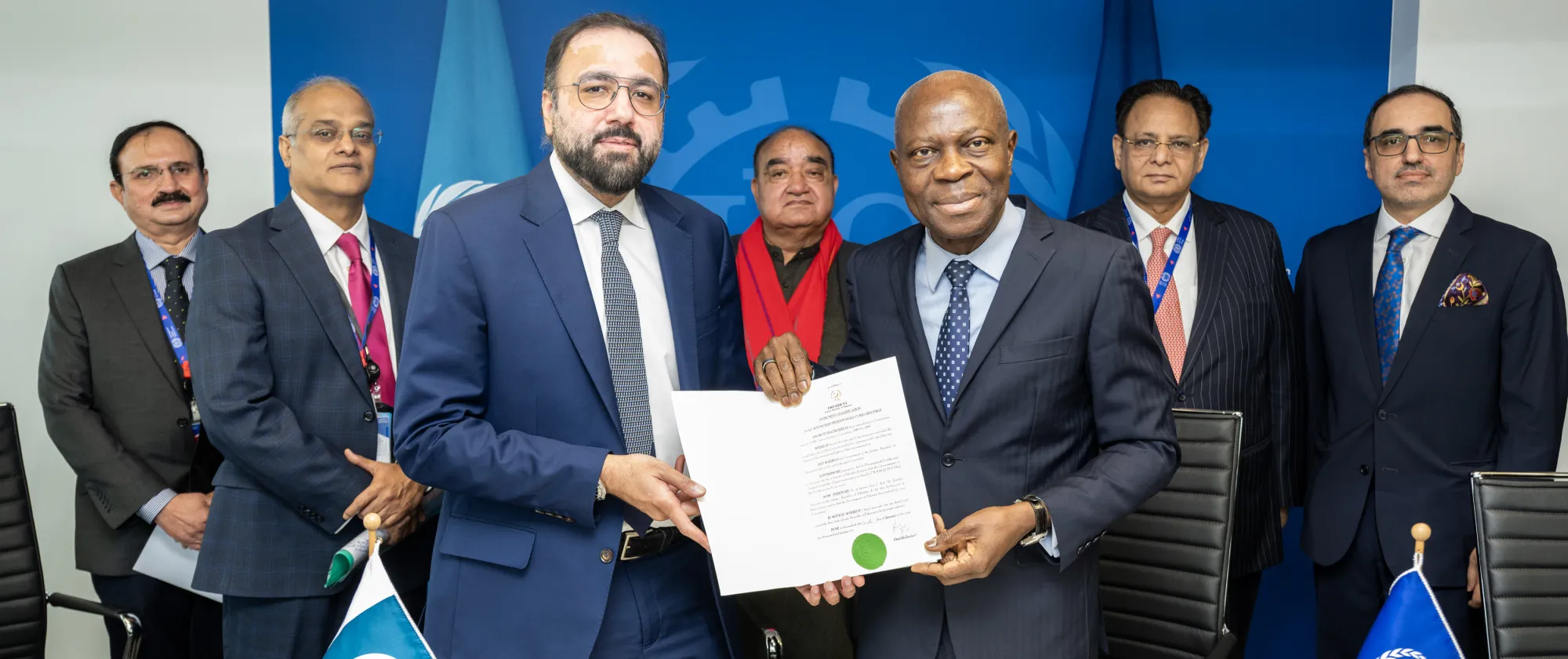 Federal Minister for Overseas Pakistanis and Human Resource Development, Chaudhry Salik Hussain, hands over the instruments of ratification for three key ILO Conventions to ILO Director-General Gilbert F. Houngbo.