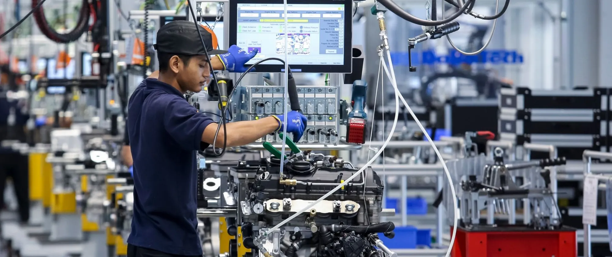 Workers at an engine assembly plant, Kedah, Malaysia 