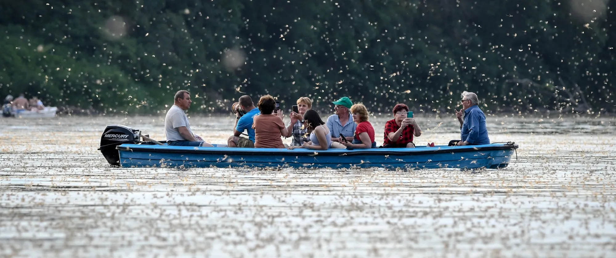 Tourists in a boat on the river