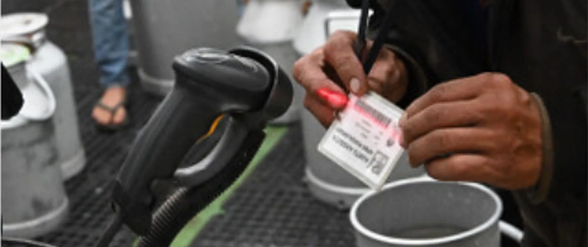 A hand scanning a card
