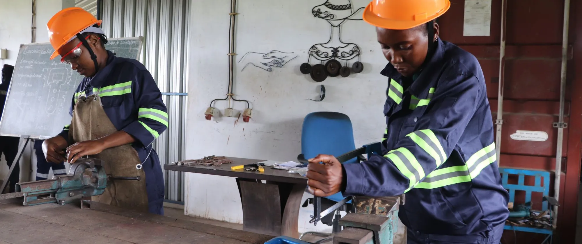 Two students doing practical work in the workshop