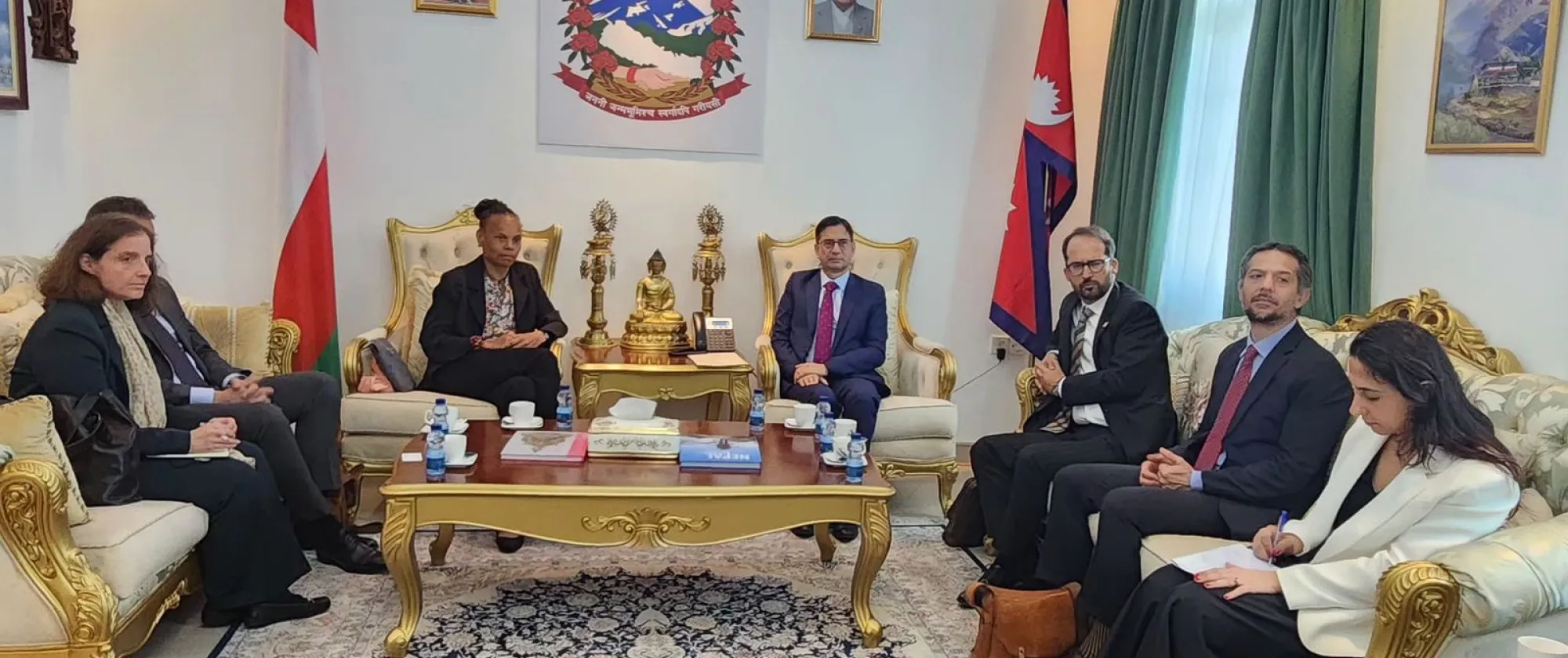 a group of women and men meeting with the Ambassador of Nepal to the Sultanate of Oman H.E. Dornath Arya