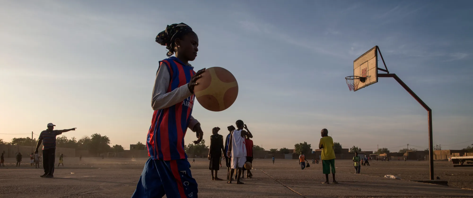girl playing basketball