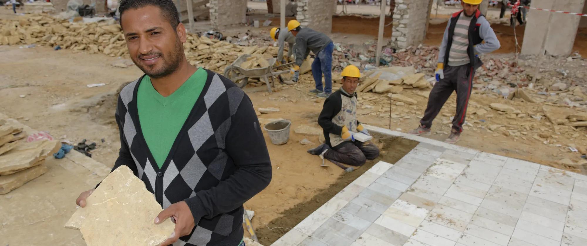 construction workers building a house