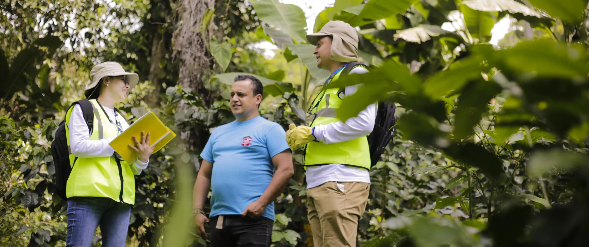 Woman labour inspector asking questions in a coffee plantation