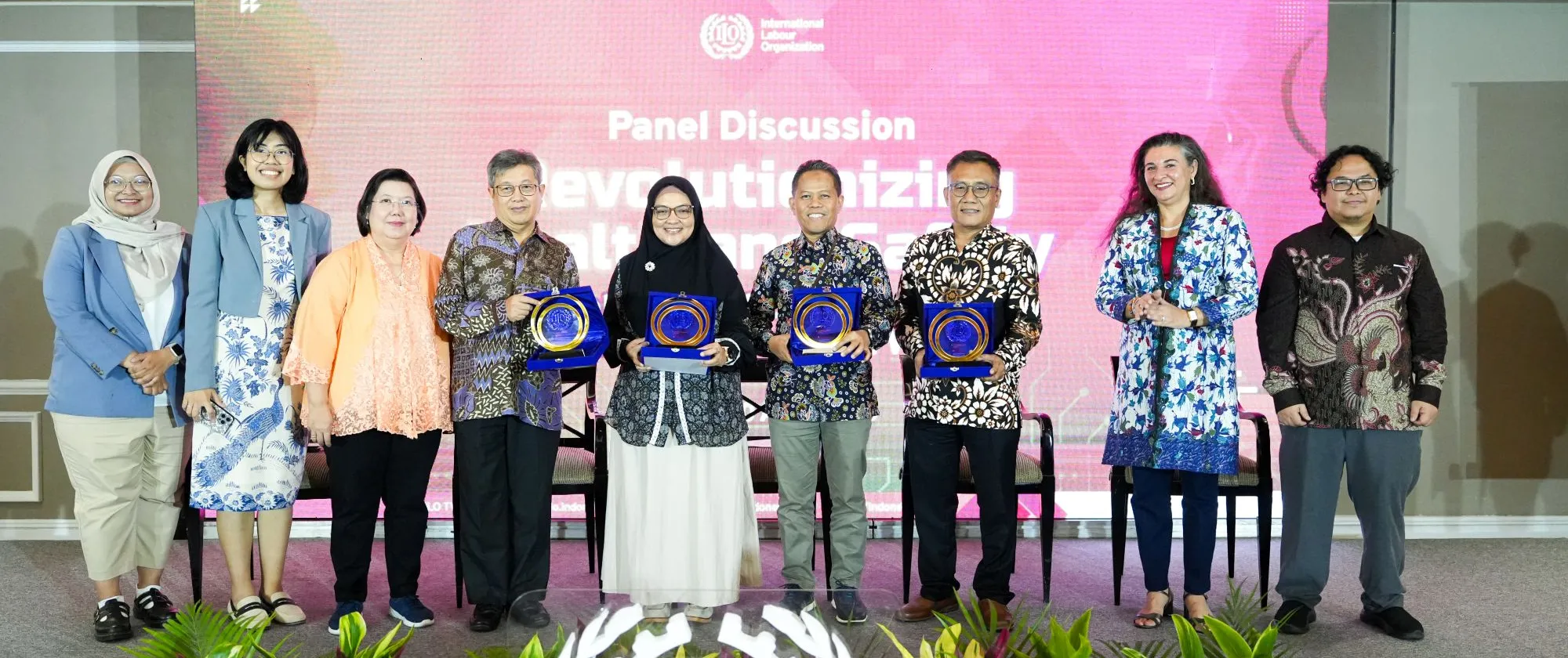 ILO gives placard to the seven speakers on the stage 
