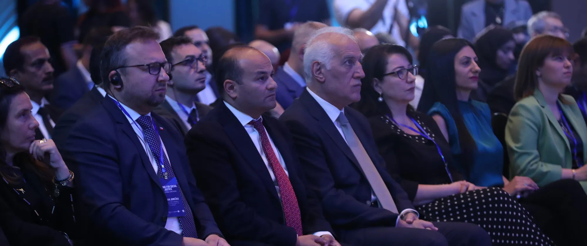 Group of people sitting in the audience