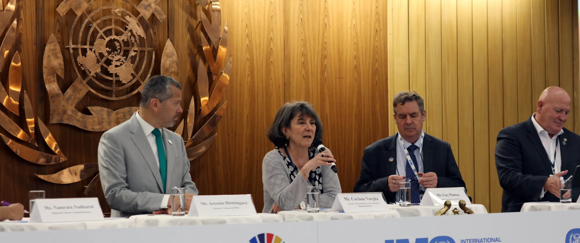 Representatives from from IMO, ILO, ICS, ITF speaking in row with a UN logo background