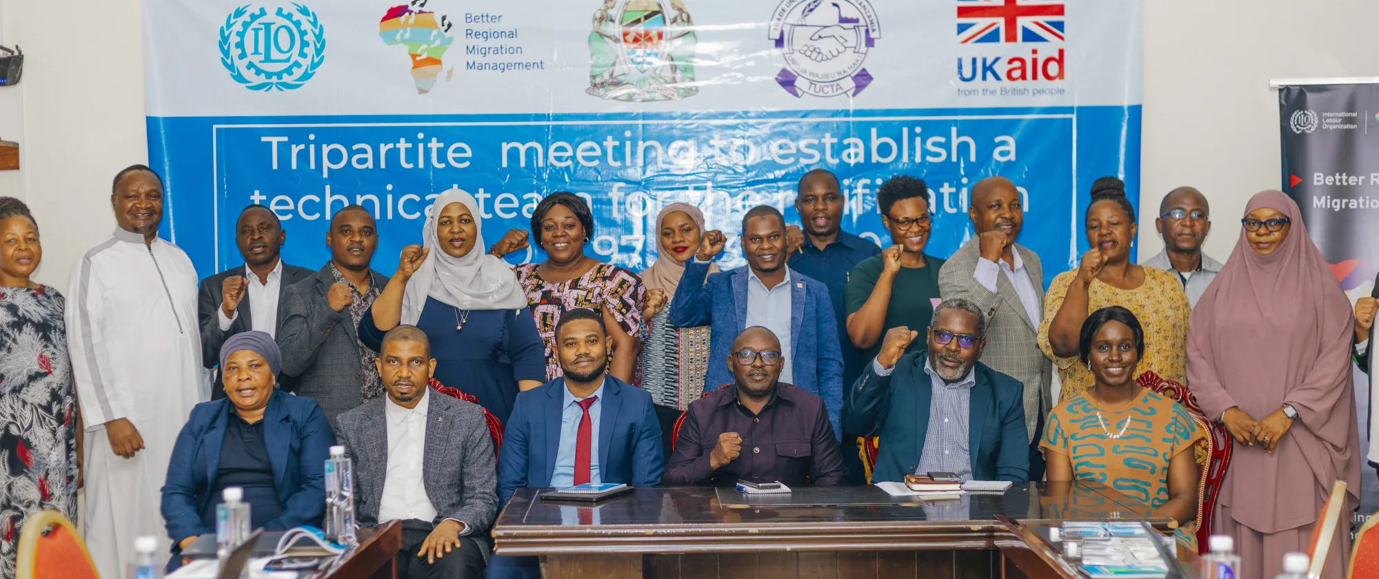 Group picture of participants standing in solidarity