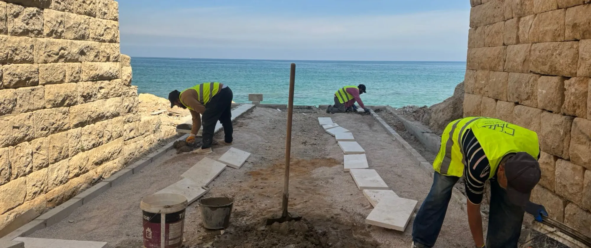 workers rehabilitating the pavement
