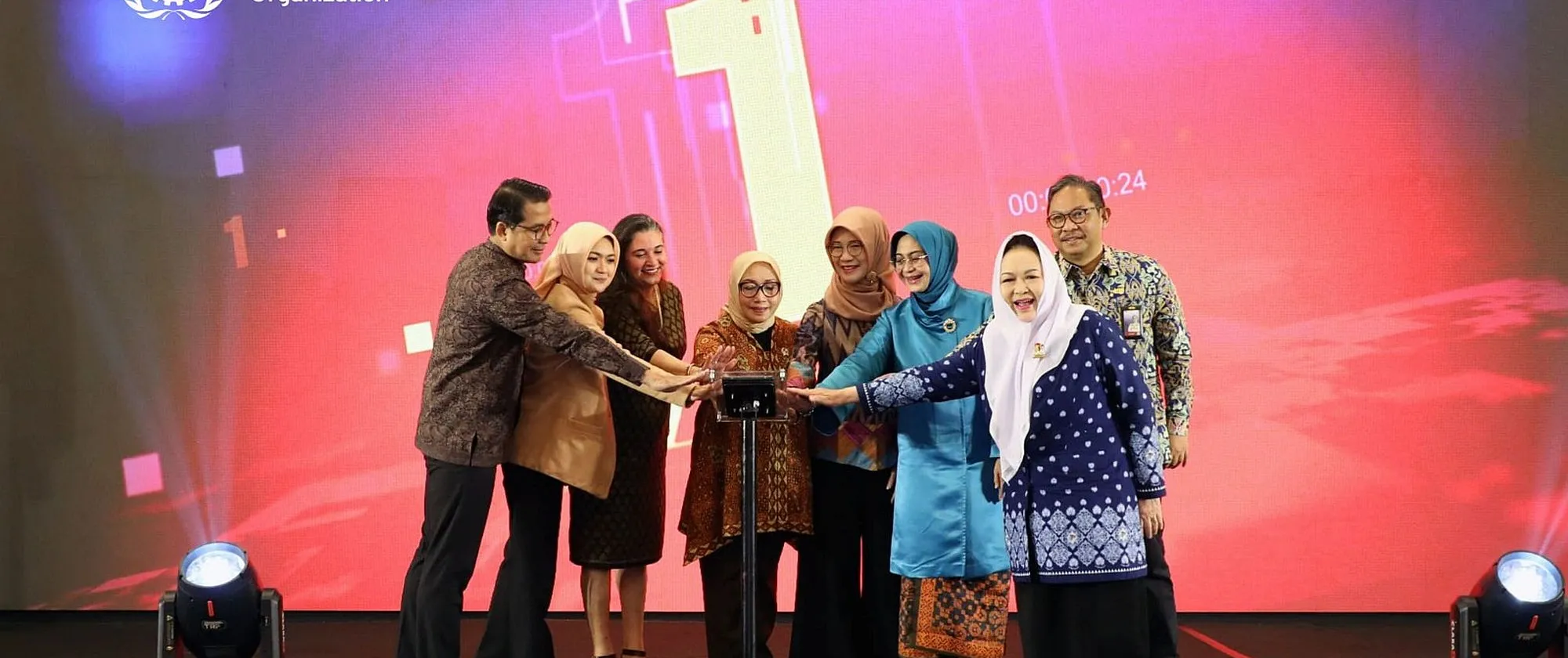 Eight people standing on the stage