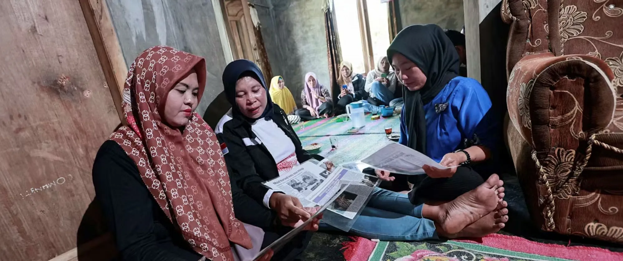 Women sitting on the floor discussing