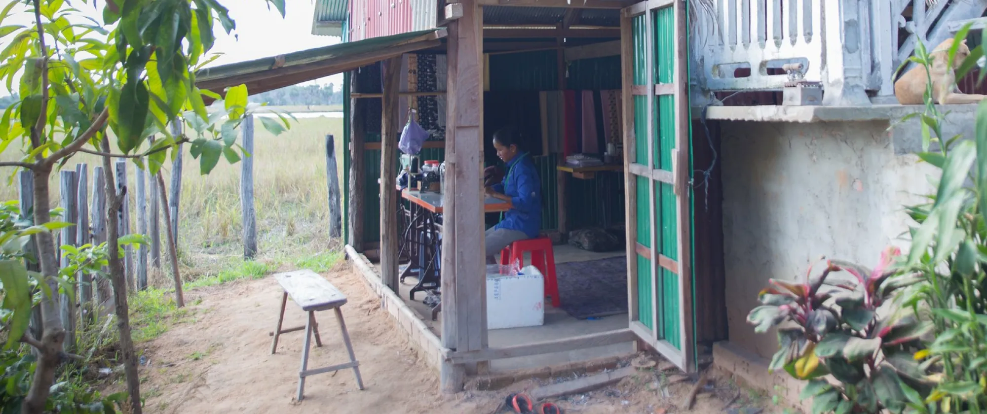 A woman sewing at home.