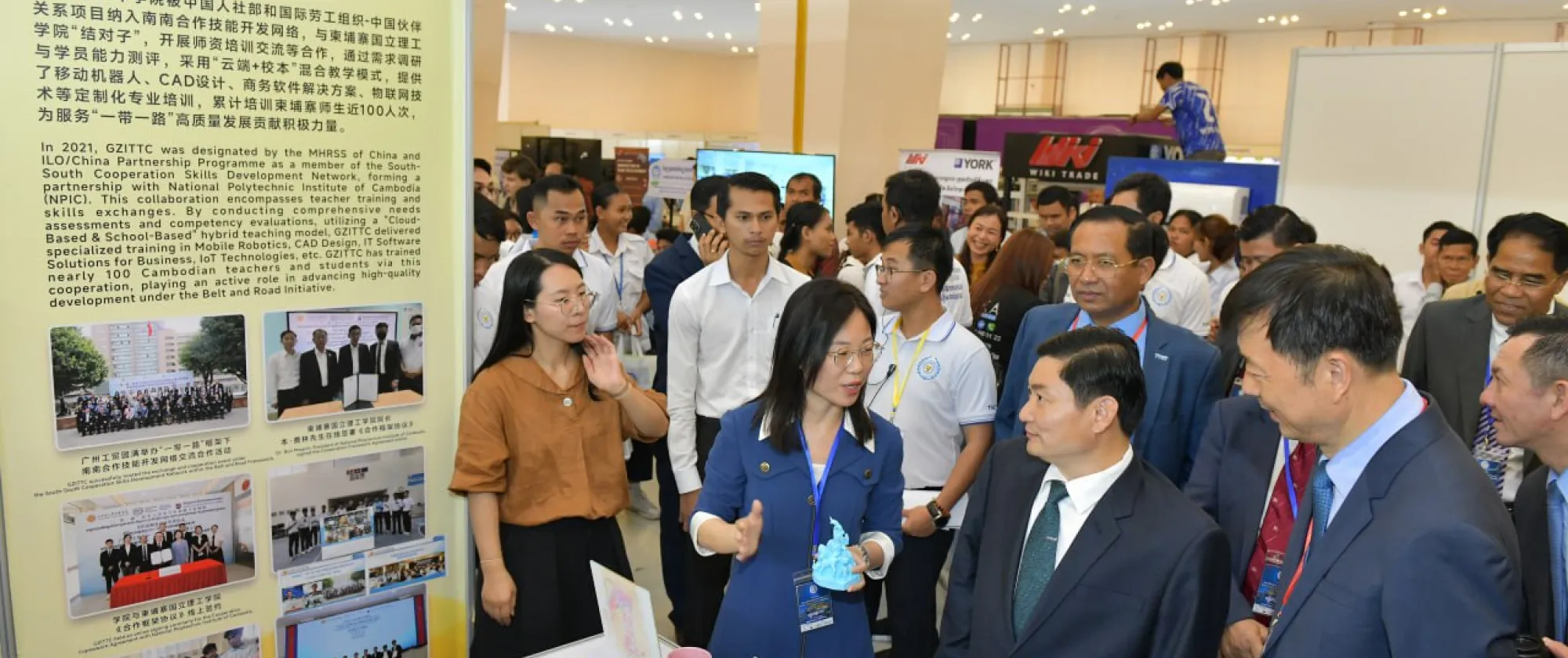 People gathering in front of a booth. 