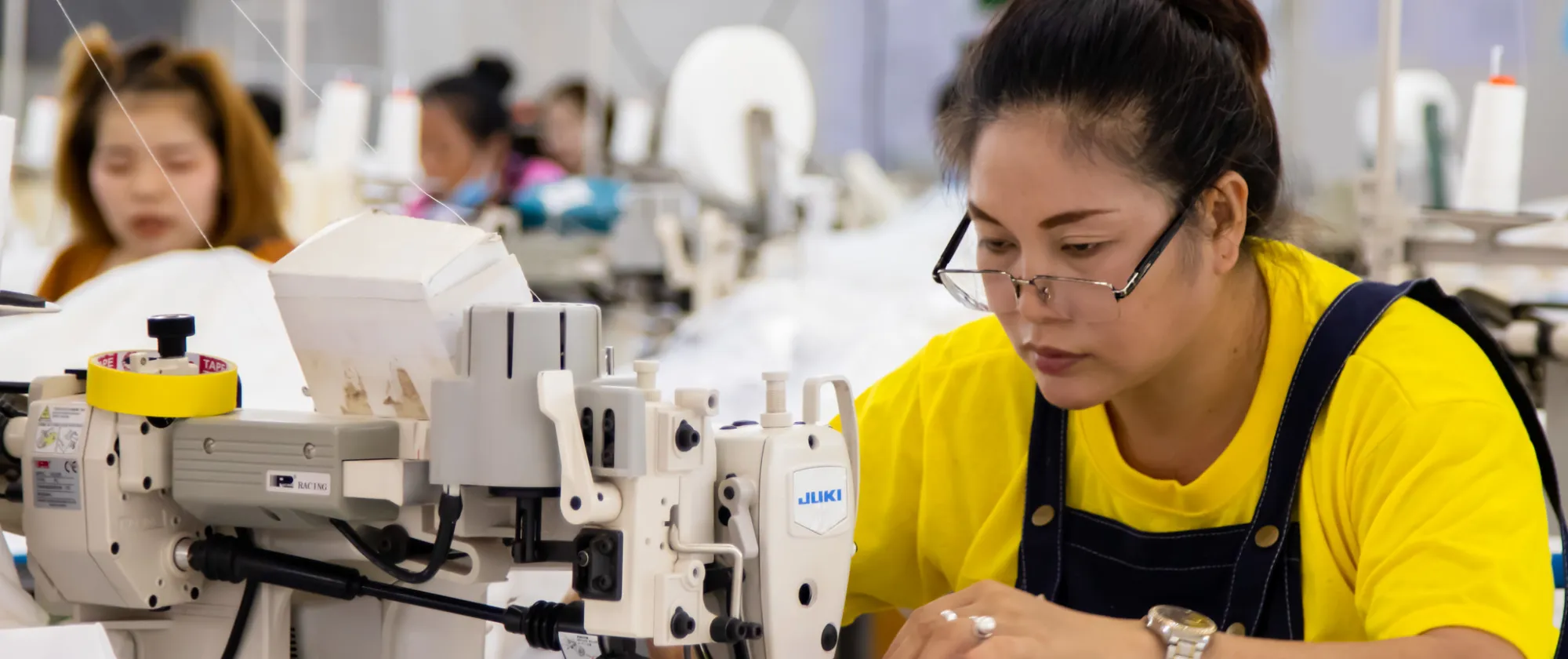 Female workers sawing.